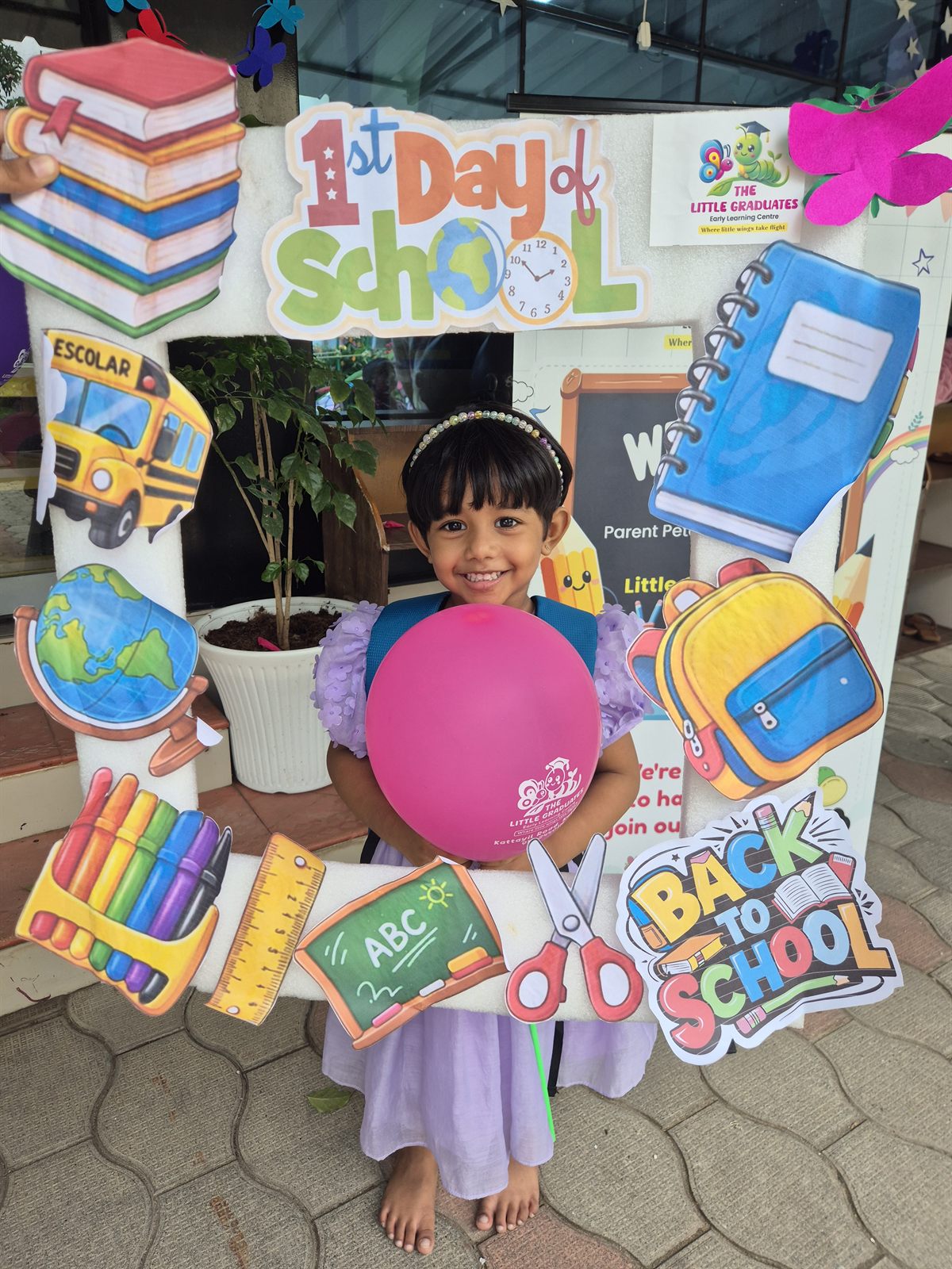 A child at the First Day of School board at The Little Graduates, Kaloor