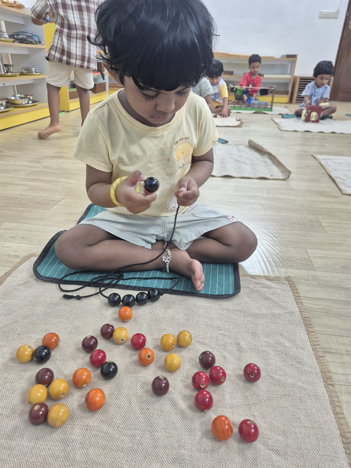 Child counting with hands-on materials