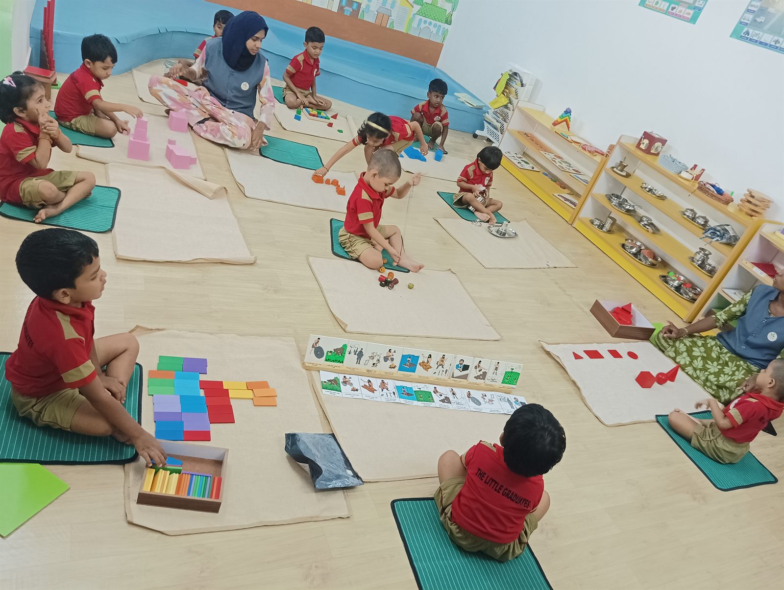 Children doing floor activities in the classroom